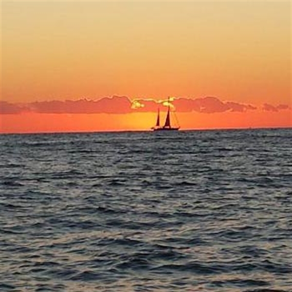 Boat against sunset